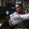 Benjamin Thomas poses with his Philly sneakers.
