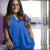 Jaldhi Patel poses for a photo in scrubs.