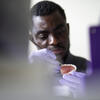 Theophilus Annor working on a pair of dentures. 