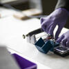 Theophilus Annor working with dental equipment.