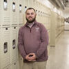 Joseph Curry leaning against school lockers.