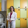 Honoree Haley Lockstein wearing a white coat and standing in a lab