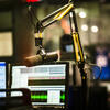 An image of a microphone inside a radio broadcast booth