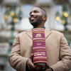 Xavier Conaway standing with the Oath Docket of the Baltimore City Circuit Court.