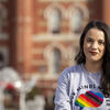Honoree Rachel Greenberg sitting outside wearing a grey t shirt with a rainbow cloud on it