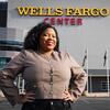 Honoree Lyric Hamilton standing in front of the Wells Fargo Center stadium in Philadelphia