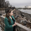 Honoree Brittney Martinez wearing a green blazer and looking out over the Delaware River