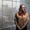 Honoree Faith Scanlon smiling and standing in front of a window