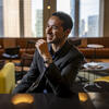 30 Under 30 honoree Victor Ficarra smiling inside of a Philadelphia restaurant.
