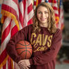 Mary Kate Meals wearing a Cleveland Cavaliers sweater, holding a basketball